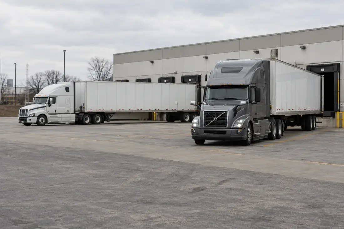 Tractors and trailers backed into freight loading docks
